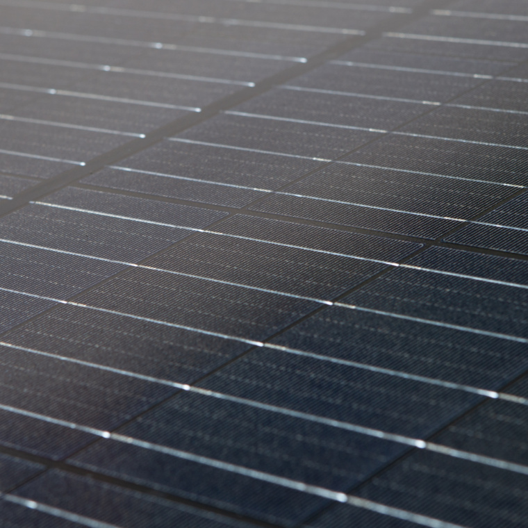 Close-up of solar panel. Dark photovoltaics module in the sea offshore.